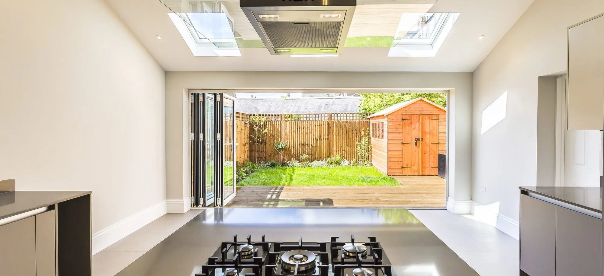 Kitchen extension with bi-fold doors opening to garden